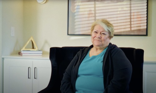 A woman wearing a blue shirt